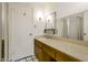 Bathroom featuring a large countertop with a sink and a shower with glass doors at 501 E Alameda Dr, Tempe, AZ 85282