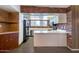 Functional kitchen with brick detailing, updated appliances, and ample counter space for cooking and entertaining at 501 E Alameda Dr, Tempe, AZ 85282
