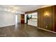 Open-concept living area with wood-look floors, and access to the kitchen with lots of natural light at 501 E Alameda Dr, Tempe, AZ 85282