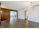 Spacious living area with natural light showcasing smooth ceilings and wood look flooring at 501 E Alameda Dr, Tempe, AZ 85282