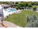 Lush backyard featuring a refreshing pool, sun loungers, and beautiful landscaping for outdoor enjoyment at 6443 E Malcomb Dr, Paradise Valley, AZ 85253