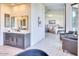 Bright bathroom with double vanity leading into the main bedroom and sitting area at 6443 E Malcomb Dr, Paradise Valley, AZ 85253