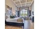 Inviting bedroom featuring two beds, coffered ceiling, a chandelier, and large windows at 6443 E Malcomb Dr, Paradise Valley, AZ 85253