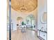 Bright and airy foyer with high ceilings and elegant chandelier at 6443 E Malcomb Dr, Paradise Valley, AZ 85253