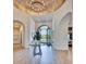 Grand foyer with arched doorways and views of the exterior at 6443 E Malcomb Dr, Paradise Valley, AZ 85253