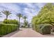 Beautiful front entrance framed by lush greenery and brick pavers at 6443 E Malcomb Dr, Paradise Valley, AZ 85253