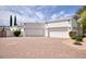 Spacious three-car garage with a brick driveway, complemented by well-maintained landscaping at 6443 E Malcomb Dr, Paradise Valley, AZ 85253