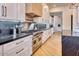 Modern kitchen with white cabinets, stainless steel appliances, and marble countertops at 6443 E Malcomb Dr, Paradise Valley, AZ 85253
