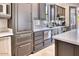 Kitchen with gray cabinetry, stainless steel appliances, and bright countertops at 6443 E Malcomb Dr, Paradise Valley, AZ 85253