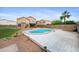 Spacious backyard featuring a swimming pool, a privacy wall, and well-maintained landscaping at 665 S Balboa --, Mesa, AZ 85206
