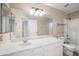 Bright bathroom featuring a large mirror, and updated vanity, and combined shower and bath at 665 S Balboa --, Mesa, AZ 85206