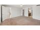 Primary bedroom featuring plush carpet, neutral walls, and an ensuite bathroom at 665 S Balboa --, Mesa, AZ 85206