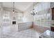 Open-concept kitchen and living area featuring tile flooring and lots of natural light at 665 S Balboa --, Mesa, AZ 85206