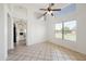 Living room with high ceilings, tile floors, large windows and neutral wall color at 665 S Balboa --, Mesa, AZ 85206