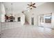 Bright, open living space with tile floors, breakfast bar and staircase, creating an inviting atmosphere at 665 S Balboa --, Mesa, AZ 85206