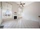 Bright, airy living room with tile flooring, fireplace, and large windows at 665 S Balboa --, Mesa, AZ 85206