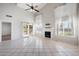 Spacious living room featuring a fireplace, tile flooring and sliding doors to the backyard at 665 S Balboa --, Mesa, AZ 85206