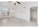 Spacious living room features tile floors, high ceilings, and bright windows at 665 S Balboa --, Mesa, AZ 85206