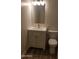 Clean bathroom featuring a white vanity, toilet, and wood-look tile flooring at 6729 N 16Th St # 21, Phoenix, AZ 85016
