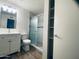 Updated bathroom with a walk-in shower, vanity, and built-in shelves at 6729 N 16Th St # 21, Phoenix, AZ 85016