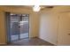 Bedroom with wood-look flooring, ceiling fan, and a sliding glass door to patio at 6729 N 16Th St # 21, Phoenix, AZ 85016