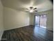 Bedroom with wood-look flooring, ceiling fan, and a sliding glass door at 6729 N 16Th St # 21, Phoenix, AZ 85016