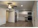 Inviting kitchen featuring stainless steel appliances, modern white cabinetry, and a ceiling fan at 6729 N 16Th St # 21, Phoenix, AZ 85016