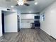 Bright, updated kitchen featuring stainless steel appliances, white cabinets, and modern flooring at 6729 N 16Th St # 21, Phoenix, AZ 85016