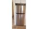 Close-up of a stainless steel refrigerator with modern design and sleek handles, next to flooring at 6729 N 16Th St # 21, Phoenix, AZ 85016