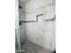 Modern tiled shower with a built-in niche and pebble floor at 6729 N 16Th St # 21, Phoenix, AZ 85016