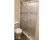 Bathroom with a glass shower door, toilet, and chrome hardware at 6729 N 16Th St # 21, Phoenix, AZ 85016