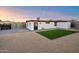 The backyard offers a mix of brick paving, gravel, and artificial turf for low-maintenance appeal at 7026 E Pasadena Ave, Paradise Valley, AZ 85253
