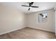 This cozy bedroom features sleek wood floors, bright natural light, and modern ceiling fan at 7026 E Pasadena Ave, Paradise Valley, AZ 85253