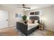 This bedroom offers a serene escape with a gray bed, stylish decor, and ample natural light at 7026 E Pasadena Ave, Paradise Valley, AZ 85253