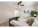 A serene bedroom setting with a gray bed, decor, and plenty of space to relax at 7026 E Pasadena Ave, Paradise Valley, AZ 85253