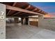 Spacious carport featuring a secure gated entrance, modern concrete, and a sturdy steel structure at 7026 E Pasadena Ave, Paradise Valley, AZ 85253