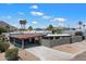 This house features a carport, modern design, minimalist landscaping, and desert mountain views at 7026 E Pasadena Ave, Paradise Valley, AZ 85253