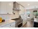 Close-up of the kitchen featuring stainless steel appliances, white cabinets, and stylish countertops at 7026 E Pasadena Ave, Paradise Valley, AZ 85253