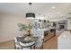 Open concept kitchen with stainless steel appliances, sleek countertops, and view to a comfortable living space at 7026 E Pasadena Ave, Paradise Valley, AZ 85253