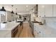 Modern kitchen with white cabinetry, a large island, stainless steel appliances, and an open floor plan at 7026 E Pasadena Ave, Paradise Valley, AZ 85253