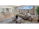 Cozy living room with access to the backyard, light furniture, and an open view to the kitchen at 7026 E Pasadena Ave, Paradise Valley, AZ 85253
