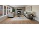 Inviting living room with a decorative fireplace, large windows, and stylish, neutral furniture at 7026 E Pasadena Ave, Paradise Valley, AZ 85253