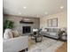 Bright living room featuring neutral décor, a cozy fireplace, and recessed lighting at 7026 E Pasadena Ave, Paradise Valley, AZ 85253