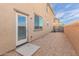 A minimalist backyard with gravel, a door, and a window at 820 E Agua Fria Ln, Avondale, AZ 85323