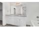 Bathroom features double sink vanity, granite countertop, and large mirror at 820 E Agua Fria Ln, Avondale, AZ 85323