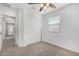 Cozy bedroom with closet, ceiling fan, and carpeted floor at 820 E Agua Fria Ln, Avondale, AZ 85323