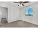 Bedroom with a ceiling fan, closet, carpeted floor, and a window at 820 E Agua Fria Ln, Avondale, AZ 85323