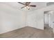 Bedroom with closet, ceiling fan, and carpeted floor at 820 E Agua Fria Ln, Avondale, AZ 85323