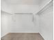 Walk-in closet featuring carpeted floor and multiple closet rods for maximum storage at 820 E Agua Fria Ln, Avondale, AZ 85323