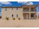 Charming two-story home with a balcony and low-maintenance landscaping at 820 E Agua Fria Ln, Avondale, AZ 85323